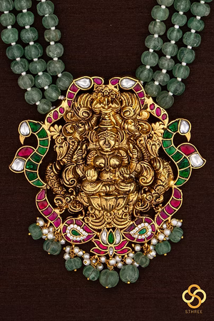 Lakshmi pendant in three liner green beads