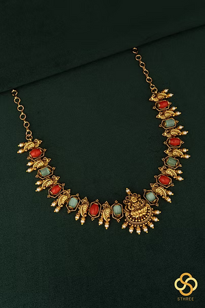 Lakshmi pendant with coral and green stones