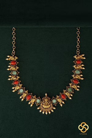 Lakshmi pendant with coral and green stones