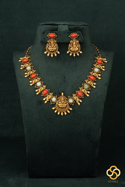 Lakshmi pendant with coral and green stones